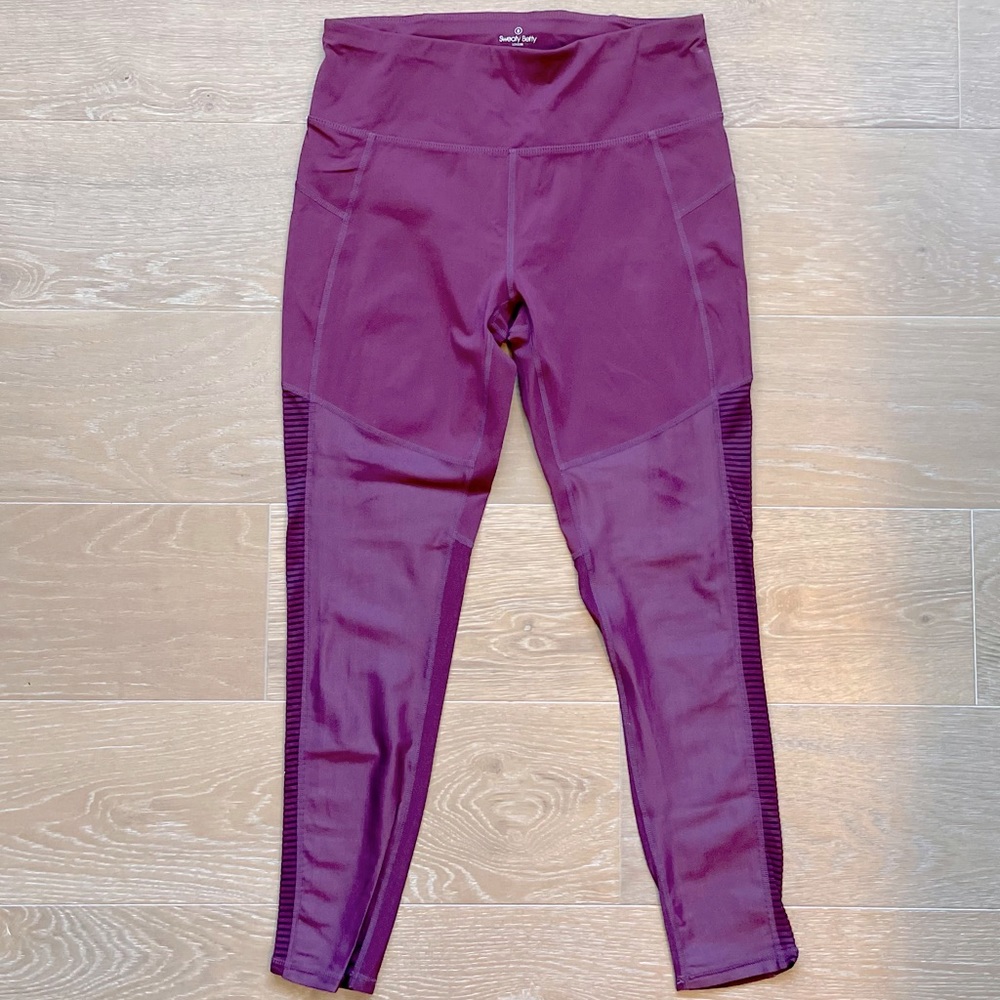 Sweaty Betty maroon mesh detailed leggings.